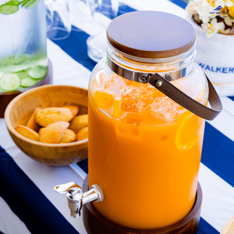 Guests are served refreshing orange juice during their yacht experience.