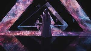 Visitors capturing a photo moment inside Aya Universe surrounded by glowing immersive digital lights