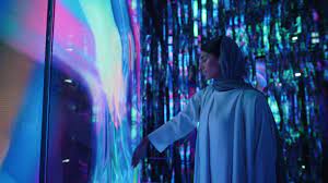 Colorful glowing light installation inside Aya Universe creating an immersive digital art experience.