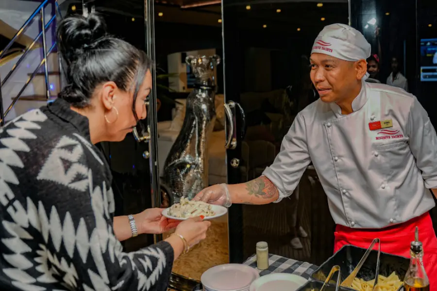 Guests dining on luxury yacht cruise in Dubai Marina