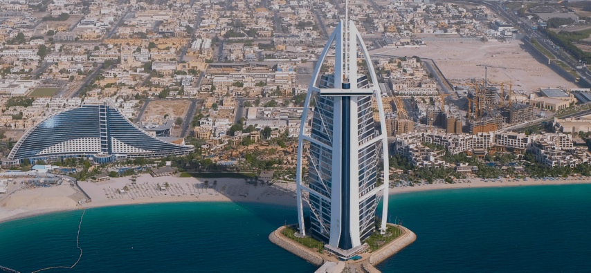 Burj Al Arab ariel view, seen from a private helicopter tour over the ocean.