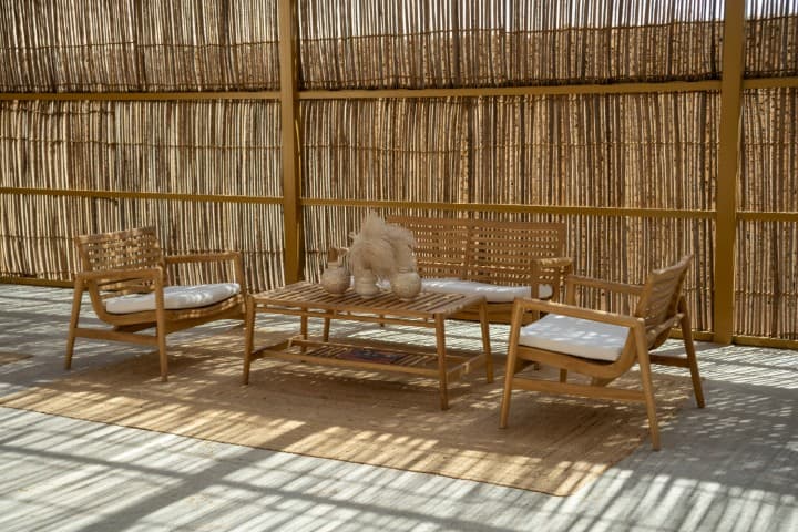 Wooden patio featuring a table and chairs, located in the Mleiha Buggy Briefing Area.