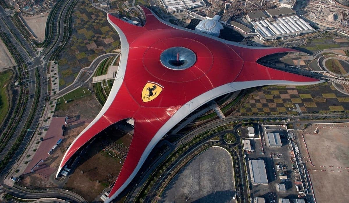 Overview of Ferrari World Abu Dhabi featuring the iconic red roof and surrounding theme park attractions