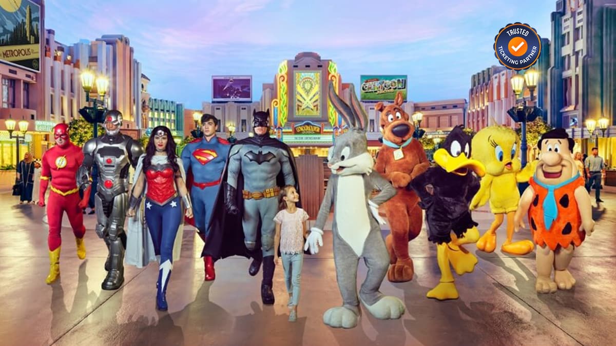 Families and visitors enjoying attractions together inside Warner Bros. World Abu Dhabi.