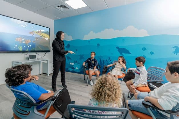 Educational exhibit area at The National Aquarium Abu Dhabi where visitors learn about marine life and ocean conservation